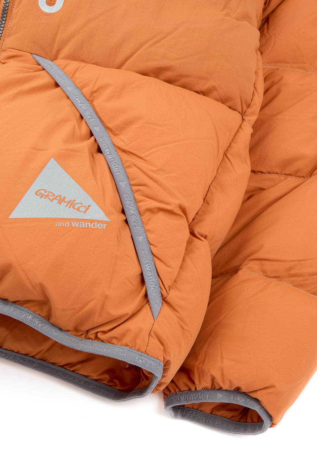 Gramicci x And Wander Down Jacket - ORANGE